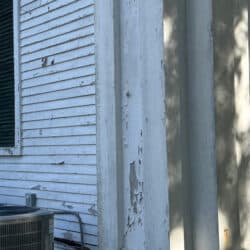 Peeling paint on corner of building