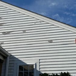 Peeling paint on wall near window