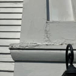 Peeling paint on building corner